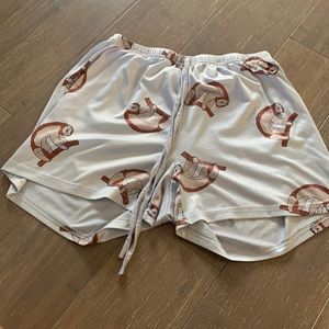 lightly worn pajama shorts with sloth pattern